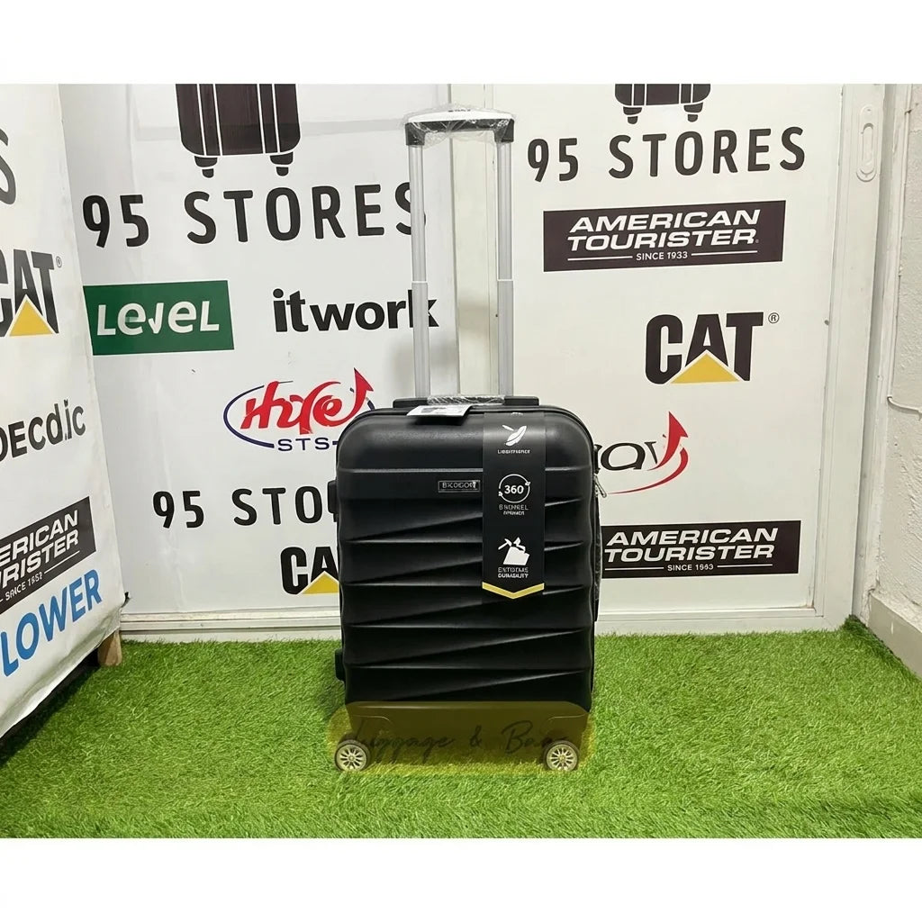 A small cabin pigeon luggage with wheels and a handle, black color.